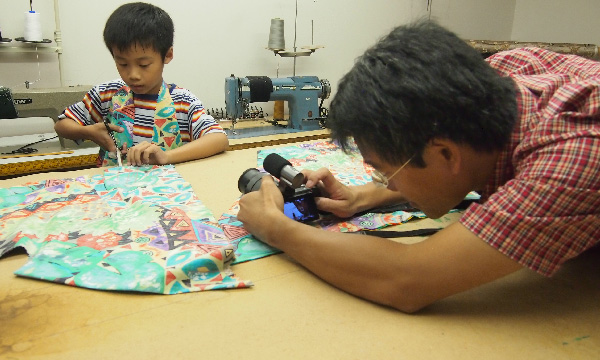 Alfred Sung, awardee of the BrokerTeam Excellency Fund in 2019, filming scenes for his documentary film, The Last Stitch.